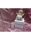 angelo seduto su scatolina portaconfetti angelo seduto su scatolina portaconfetti